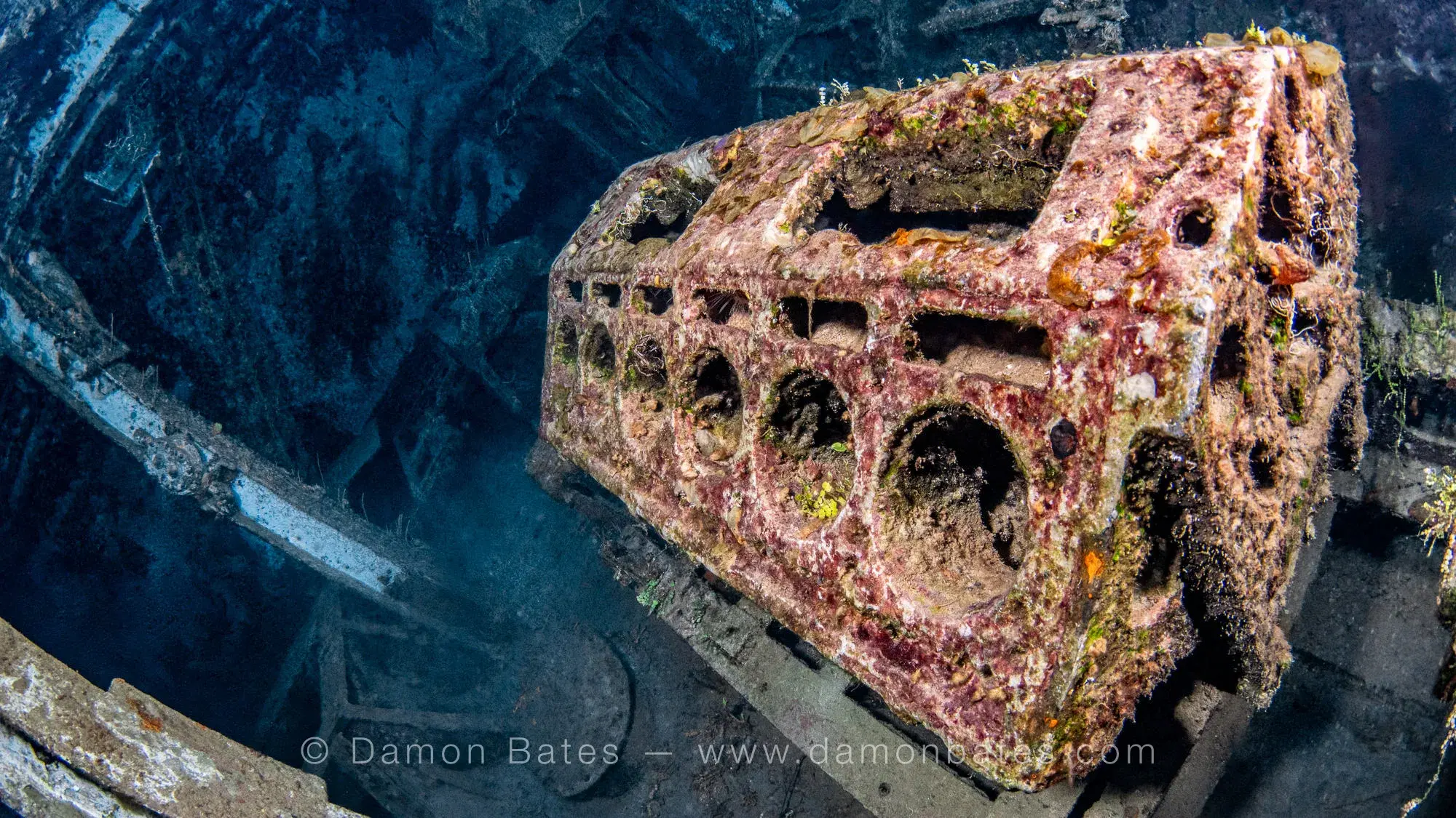 V12 engine block that powered the air compressors inside the USS Kittiwake, Grand Cayman, 2025 — underwater photograph by Damon Bates